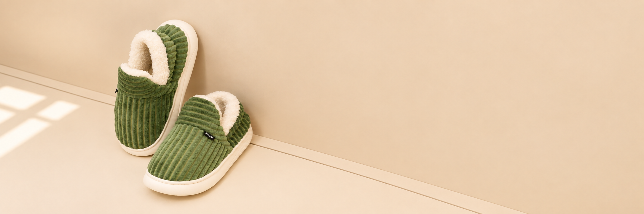 Green fleece-lined Snuggli slippers