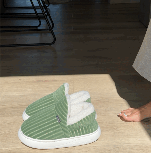 Green Snuggli slippers with cream lining